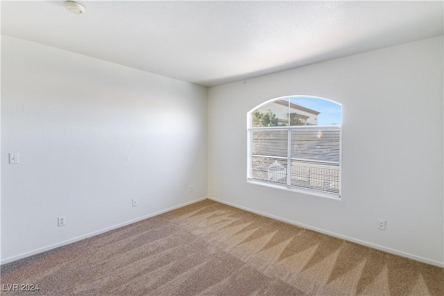 4555 E Sahara Ave Unit 223, Las Vegas, NV 89104 - empty room with a smoke detector and carpet flooring