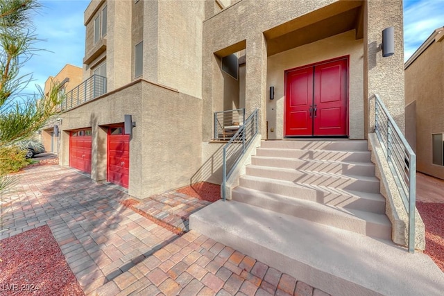 doorway to property featuring a garage