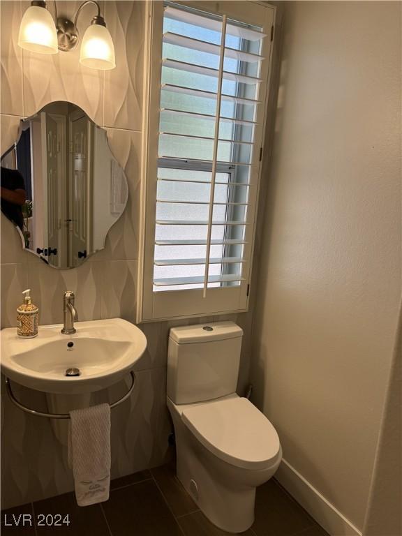 bathroom with tile patterned flooring and toilet