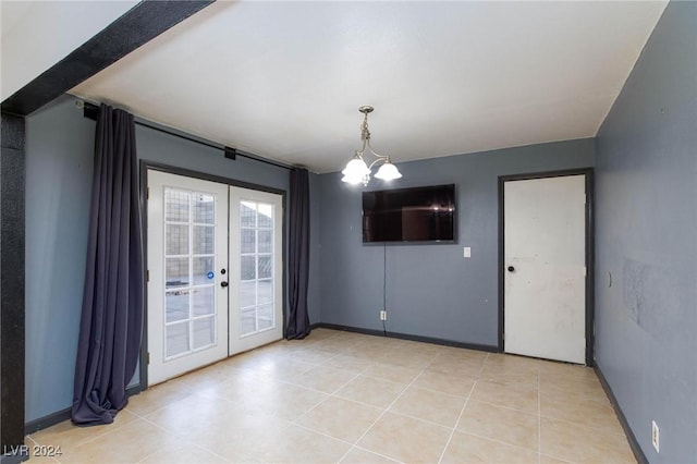 interior space featuring french doors, light tile patterned floors, and a notable chandelier