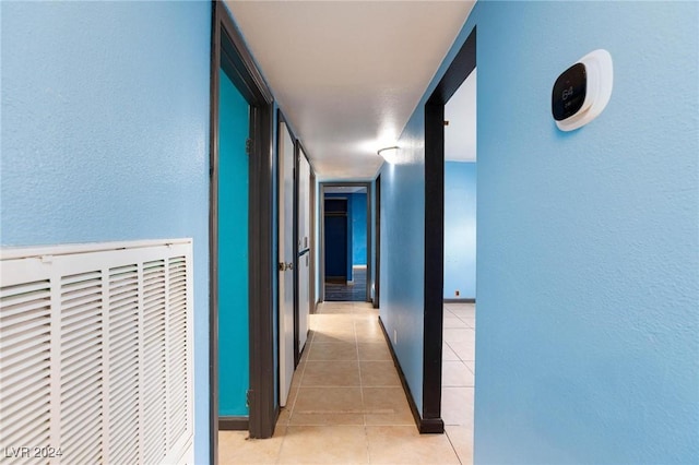 hallway with light tile patterned flooring