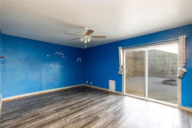 unfurnished room with hardwood / wood-style floors and ceiling fan