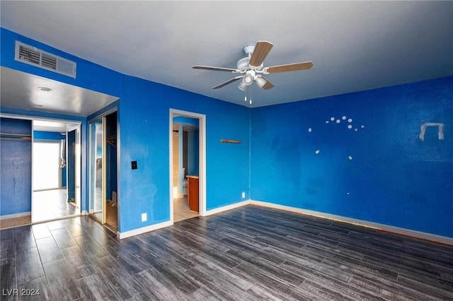 interior space with a closet, dark hardwood / wood-style floors, and ceiling fan