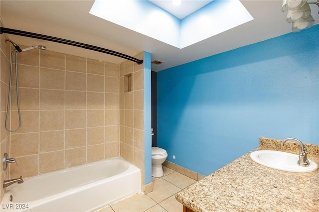 full bathroom with tile patterned floors, vanity, toilet, and tiled shower / bath