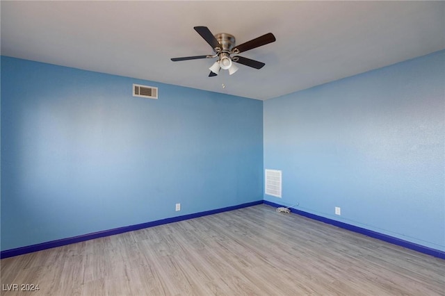 unfurnished room featuring light hardwood / wood-style flooring and ceiling fan