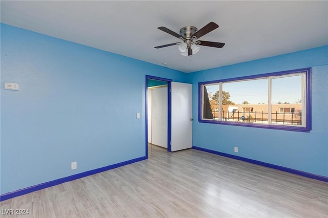 unfurnished bedroom featuring light wood-type flooring, a closet, and ceiling fan