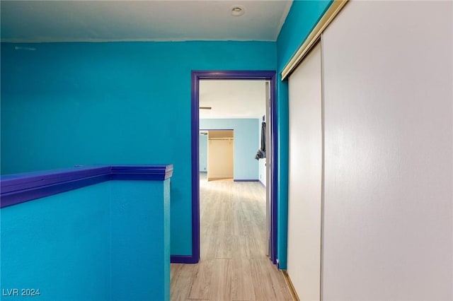 corridor featuring light hardwood / wood-style floors