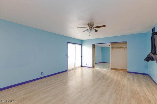 unfurnished bedroom with ceiling fan, a closet, and light wood-type flooring