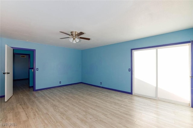 unfurnished room featuring ceiling fan and light hardwood / wood-style floors