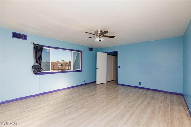 unfurnished room featuring ceiling fan and light hardwood / wood-style flooring