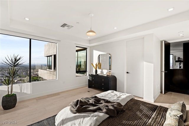 bedroom with light hardwood / wood-style flooring