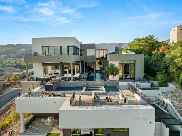 back of house with a mountain view