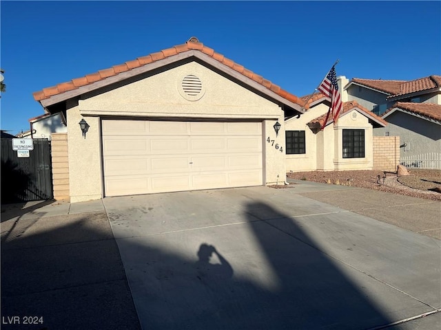 4764 Anchorage St, Las Vegas, NV 89147 - single story home with driveway, stucco siding, a garage, and a tiled roof
