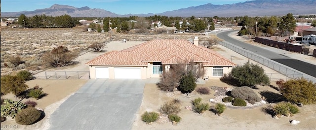 birds eye view of property with a mountain view