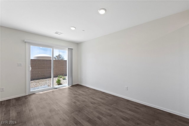 empty room featuring dark wood-type flooring