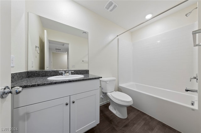 full bathroom with toilet, vanity, shower / bath combination, and hardwood / wood-style flooring