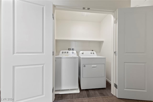 clothes washing area featuring independent washer and dryer and dark wood-type flooring