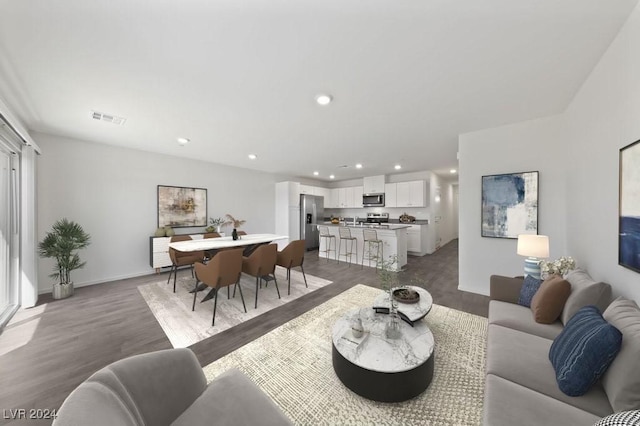 living room with dark hardwood / wood-style flooring