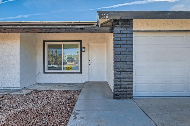 entrance to property featuring a garage