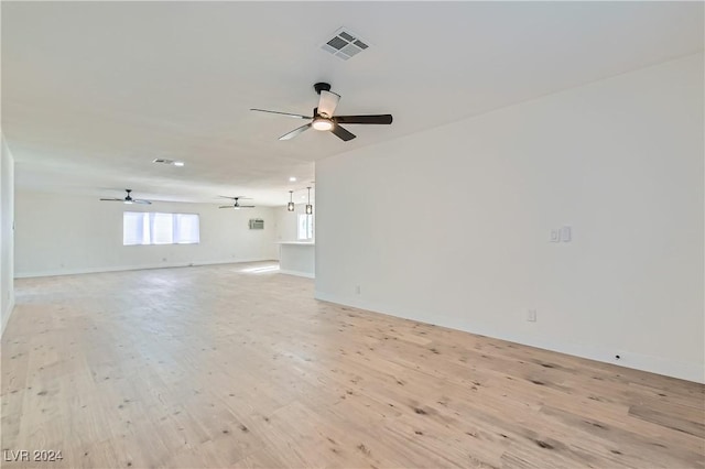 spare room with light hardwood / wood-style flooring