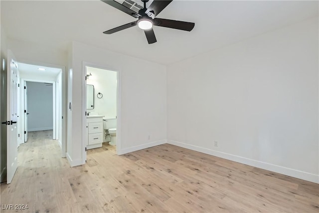 unfurnished bedroom with ceiling fan, connected bathroom, and light hardwood / wood-style flooring