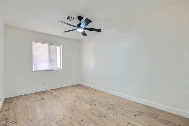 spare room featuring light hardwood / wood-style floors