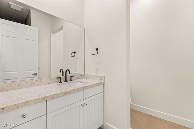 bathroom featuring tile patterned floors and vanity