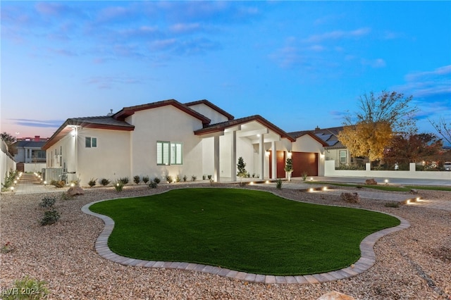 exterior space with a yard and a garage