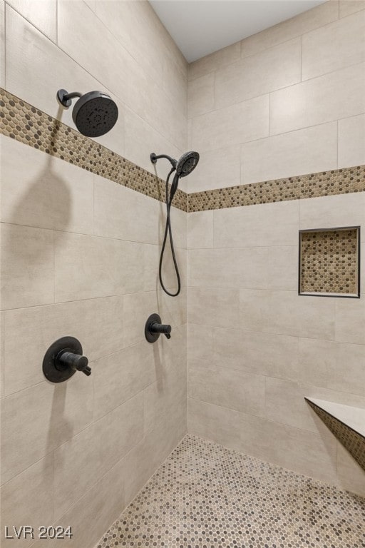 bathroom featuring a tile shower