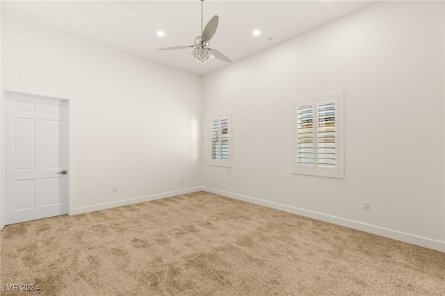 empty room with carpet and ceiling fan