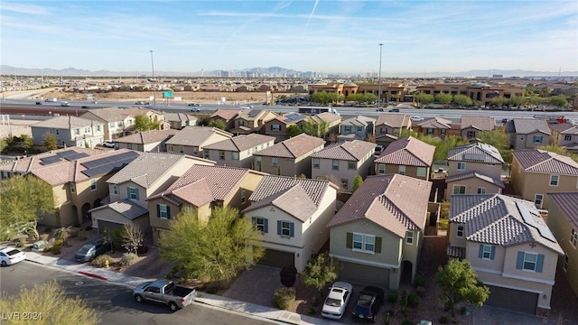 birds eye view of property with a mountain view