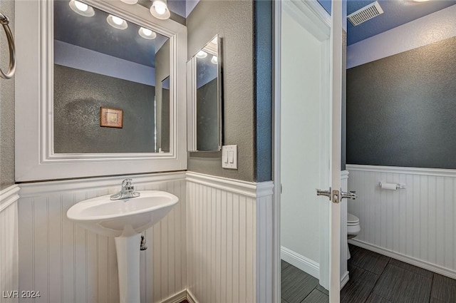 bathroom with tile patterned flooring and toilet