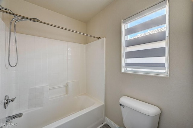 bathroom featuring shower / bathing tub combination and toilet