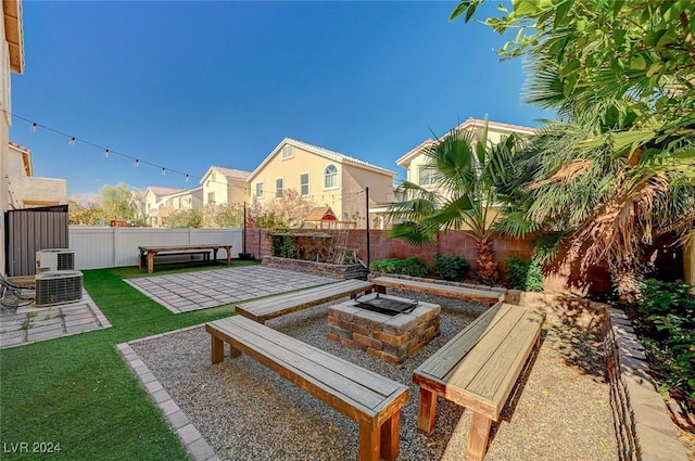 view of patio / terrace with central AC and an outdoor fire pit