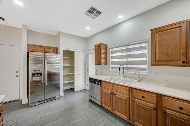 kitchen with sink and appliances with stainless steel finishes