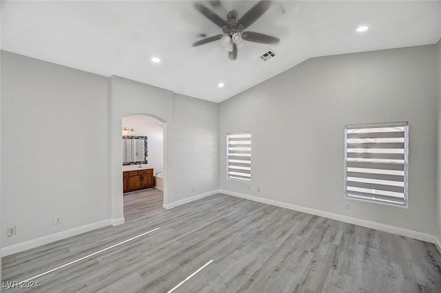 interior space with light hardwood / wood-style floors, vaulted ceiling, and ceiling fan