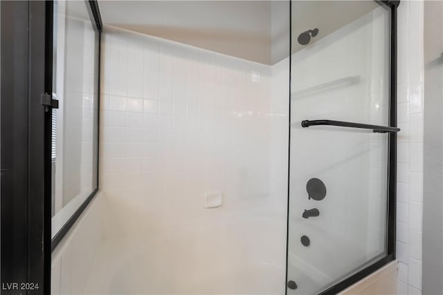 bathroom featuring enclosed tub / shower combo