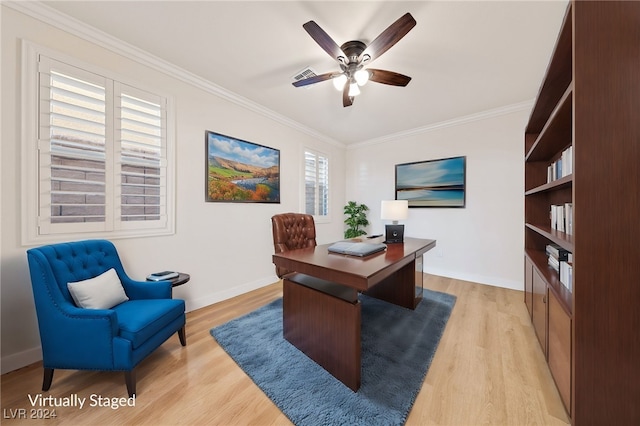 office featuring plenty of natural light, ornamental molding, and light wood-type flooring