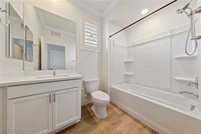 full bathroom with vanity, crown molding, shower / washtub combination, toilet, and wood-type flooring