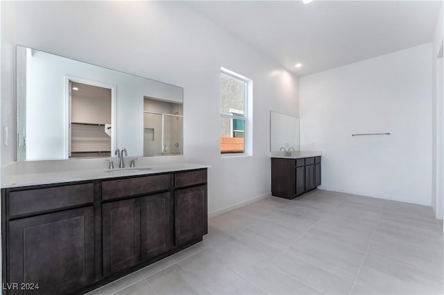 bathroom featuring tile patterned flooring and vanity