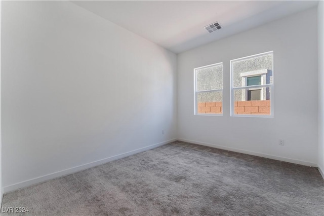 spare room featuring carpet flooring