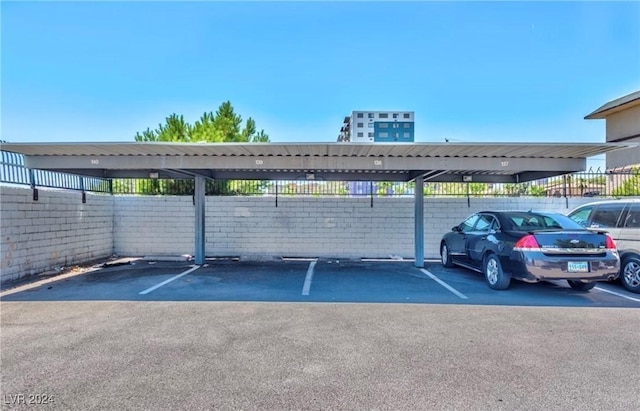 view of parking / parking lot with a carport