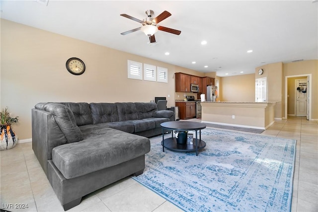 tiled living room featuring ceiling fan