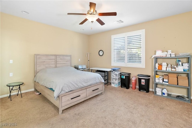 bedroom featuring ceiling fan and light carpet