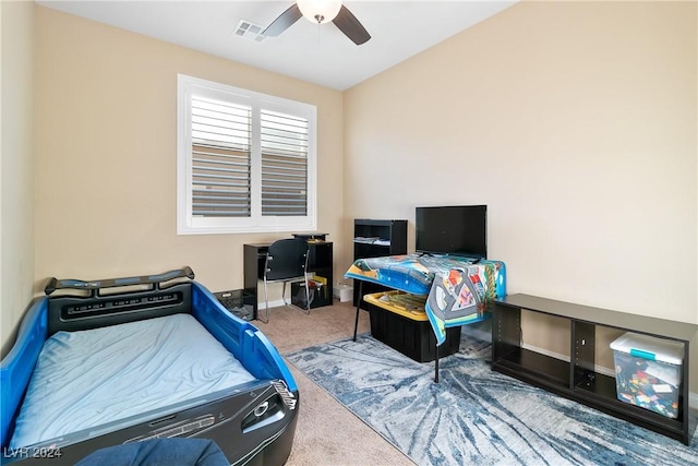 carpeted bedroom with ceiling fan