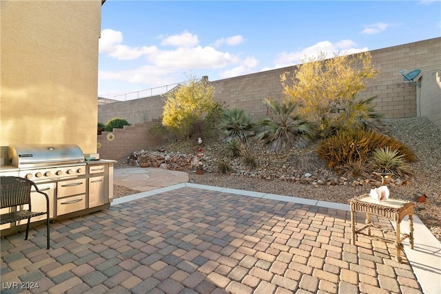 view of patio featuring a grill