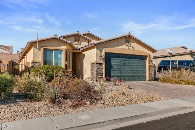 view of front of property with a garage