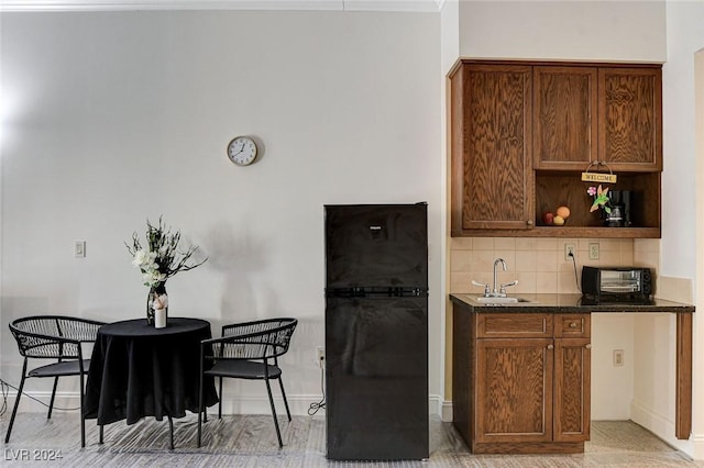 kitchen featuring tasteful backsplash and sink