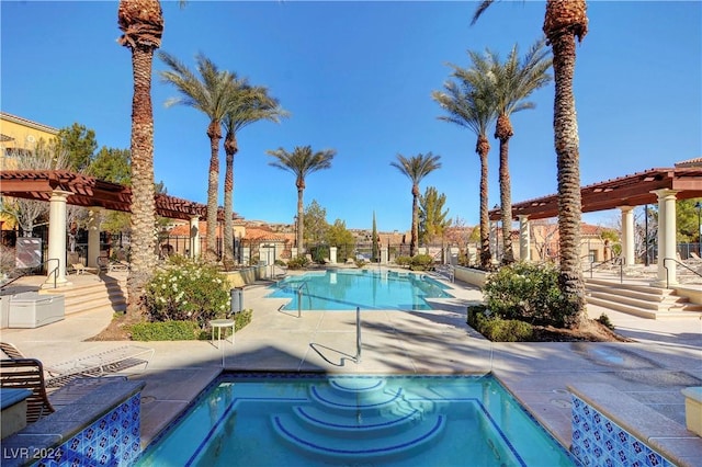 view of pool featuring a pergola and a patio area