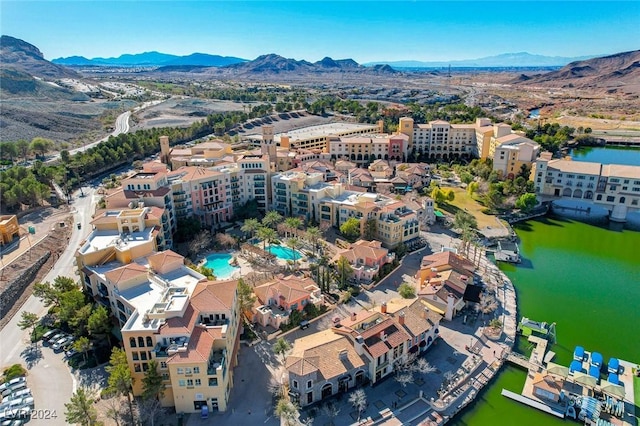 birds eye view of property featuring a water and mountain view